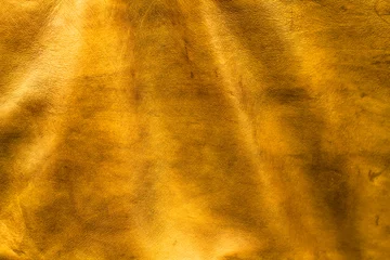 Foto op Plexiglas Texture cuir jaune doré avec plis © OneClic