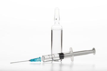 Glass medicine ampoule and Syringe on white background