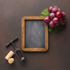 Cute arrangement of grapes on blackboard