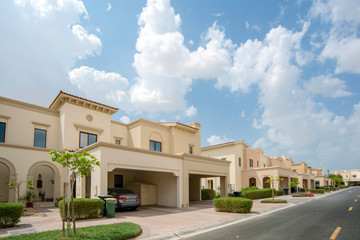 Luxury villa compound housing development with beautiful blue sky with white clouds