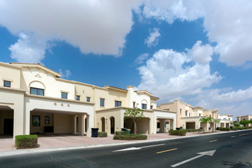 Fototapeta na wymiar Luxury villa compound housing development with beautiful blue sky with white clouds