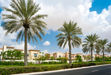 Fototapeta na wymiar Luxury villa compound housing development with beautiful blue sky with white clouds