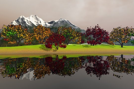 Beautiful trees with green yellow and red leaves, an autumnal landscape, nice reflection in the waters and a snowy mountain in the background.