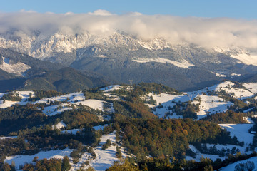 Fototapeta na wymiar The Carpathians Bucegi Mountains Romania landscape winter snow ice clouds sunlight morning 