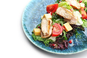 Plate with tasty salad on white background, closeup