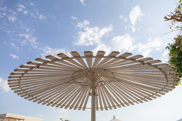 sunshade umbrella on sky background