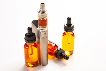 Electronic cigarette and liquid for it on a white background. Smoking concept. Fashion for Smoking...