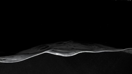 Super slow motion of splashing water isolated on black background. Filmed on high speed cinema camera, 1000 fps.