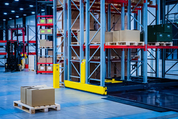 Stock. Boxes in stock. Warehouse rental. Pallet with boxes in a warehouse. Warehousing services. Carton boxes on a pallet. Racks for storage of products. Warehouse racks. Cargo storage.