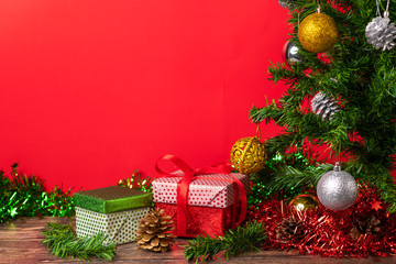 The main symbol of the New Year is a Christmas tree decorated with bright Christmas toys, under which there are many bright gifts. Close-up. Atmosphere of magic and happiness. New Year's Eve. Gifts.