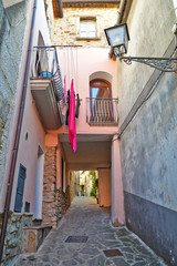 Province of Salerno, Italy, 10/21/2017. A narrow road between the old houses of a rural village.