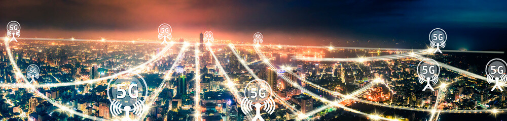 Obraz na płótnie Canvas aerial view city at night and 5g network tech concepts