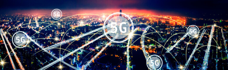 aerial view city at  night  and 5g network  tech concepts