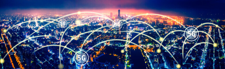 aerial view city at  night  and 5g network  tech concepts