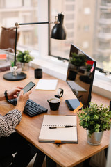 Businessman writing message on phone