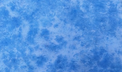 Background of dyed fabric. Beautiful abstract background. Sky, sea, blue background