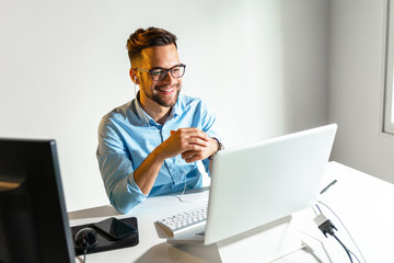 Young man having a conference call	