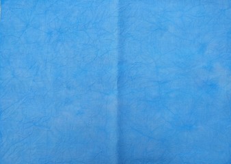 Background of dyed fabric. Beautiful abstract background. Sky, sea, blue background