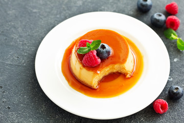 delicious dessert creme brulee with berries.