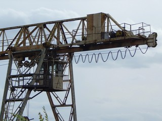 Fototapeta na wymiar Overhead crane. Cabin and winch - elements of an overhead crane. Photo