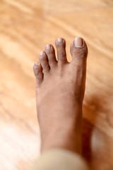 Top view barefoot on House floor tiles background. men feet. Barefoot.