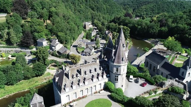 Aerial 4K footage, over the valley. World heritage Durbuy Castle in Belgium, province of Luxembourg in the Wallonia region. Beautiful landscape with river, sunny weather during summer season.