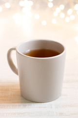 Plain cup of tea with lighting background