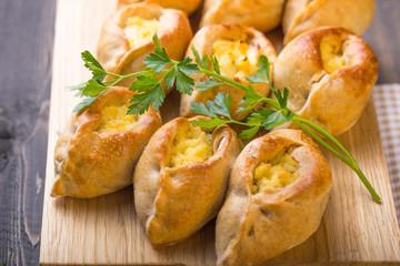 Rasstegai pie with fish filling and rice , egg. Traditional meal of Russian cuisine. © Maria