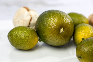 fresh green lemon on white background