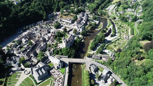 Aerial 4K footage, over the valley, where Durbuy Castle is located. Belgium, province of Luxembourg in the Wallonia region. Beautiful landscape with river, sunny weather during summer season.