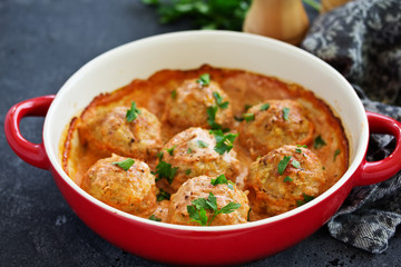 Meatballs in a creamy tomato sauce.