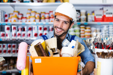 foreman holding basket with tools