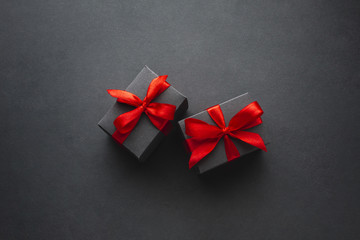 Cute gift boxes on black background