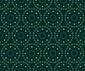 Seamless circular pattern of polka dot ring in shades of green.
