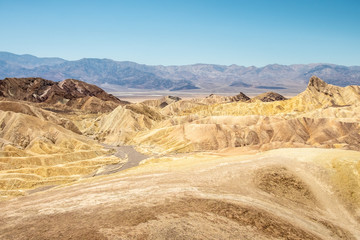 Eroding volcanic ash and silt hills, badlands, at Zabriskie Point, Death Valley National Park, California, USA