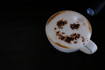 cup of coffee on black background