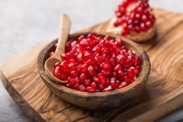 Fresh sliced pomergranate on a plate on a table