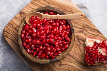 Fresh sliced pomergranate on a plate on a table