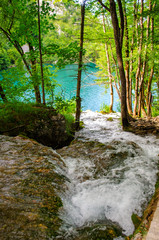 Picturesque landscapes of Plitvice Lakes with waterfalls, mountain rivers, forests and mountains