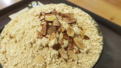 Sweet carved ice with been power on top. Sulbing a popular, Traditional Korean summer dessert.