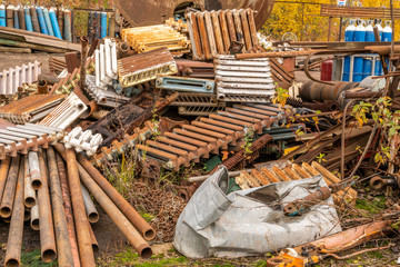 Scrap metal waste is stored in a recycling yard