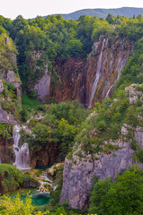 Fototapeta na wymiar Picturesque landscapes of Plitvice Lakes with waterfalls, mountain rivers, forests and mountains