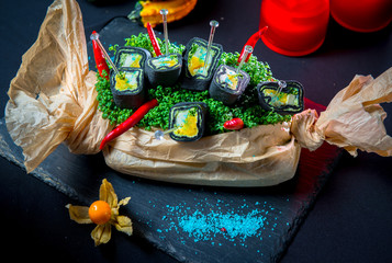 Black roll with baked pumpkin, mozzarella cheese and Basil sauce