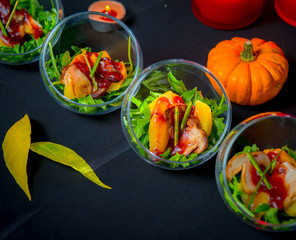 Baked pumpkin with arugula and porcini mushrooms with wild cranberry sauce