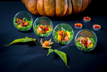 Baked pumpkin with arugula and porcini mushrooms with wild cranberry sauce