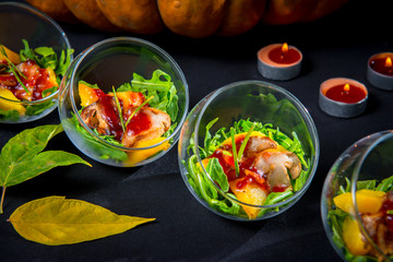 Baked pumpkin with arugula and porcini mushrooms with wild cranberry sauce
