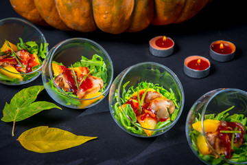Baked pumpkin with arugula and porcini mushrooms with wild cranberry sauce