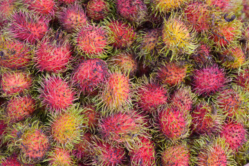 Healthy fruits rambutans upper view on local market sweet Thai fruit