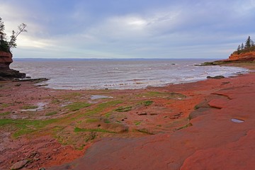 View of Burntcoat Head Park, a red rock park on the Bay of Fundy with the largest tides in the world