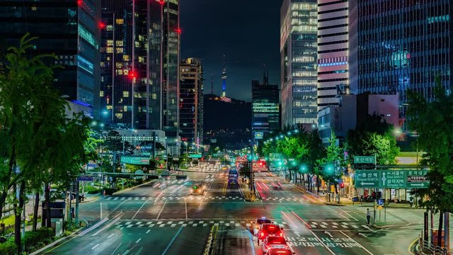 Seoul city and Skyscraper and Traffic at night intersection in yongsan, South Korea. 4K Timelapse.